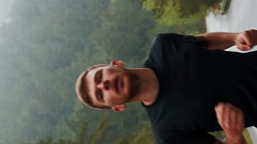 Man Running Outside on Overcast Day