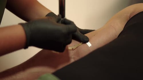 Latin mexican nurse and soldier put tape on iv drip intravenous therapy multivitamins treatment vita