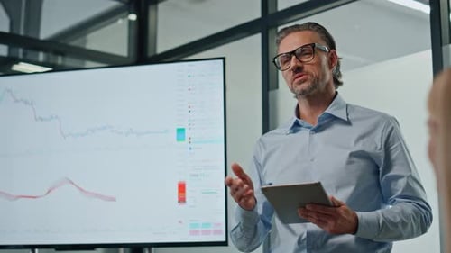 Charismatic Businessman Showing Tv Screen Close Up