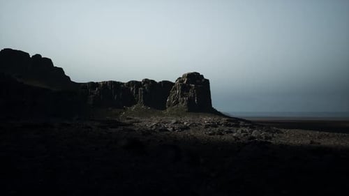 Dark Rocky Outcropping in Desert