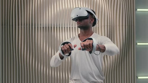 African American Futuristic Man Enjoy VR Game Using Virtual Reality in Futurism Studio Gamer Male