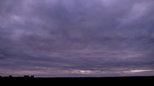 Dramatic Time Lapse of Dark Clouds and Sunset