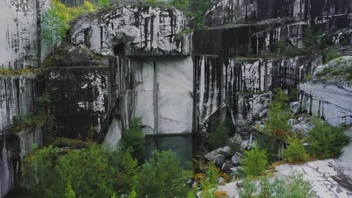 Drone Approach Water Pool in Abandoned White Marble Quarry in Carrara Italy