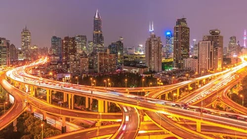 Shanghai at Night Busy Freeway Traffic Lines Under City Skyscrapers