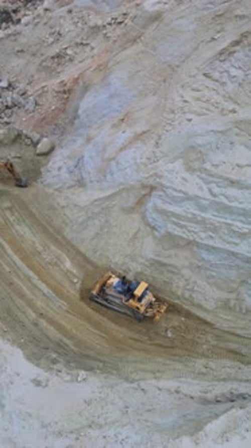 Aerial View Bulldozer Working in Quarry Landscape