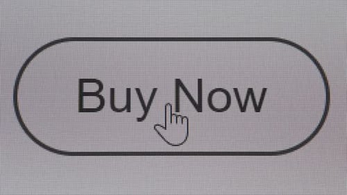 Clicking buy now button on the white computer screen