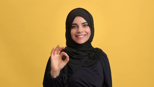 Beauty Turkish Woman in Black Headscarf Gesturing Ok Okay Cool Approve Posing Isolated Orange Studio