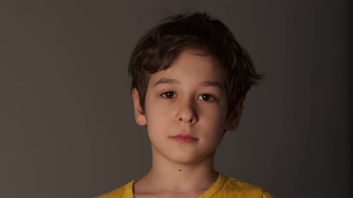 Thoughtful Boy Looking at Camera Young Sad Thinking Curiosity Kid Looking at Camera Close Up Indoors