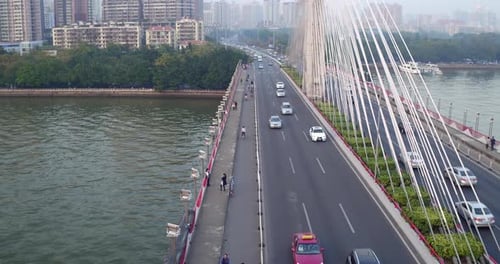 Traffic moving along the bridge over Pearl river in the afternoon. Guangdong, China.