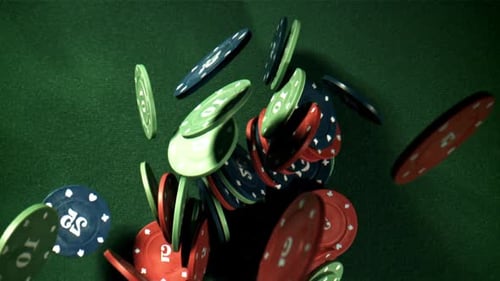 Casino Chips Falling on Green Surface