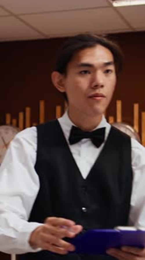 Hotel Receptionist Helping Guest Check In