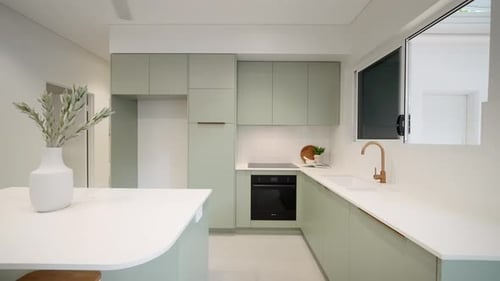 Modern Kitchen Interior with Light Green Cabinets