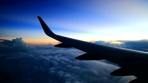 morning cloudy sky with sunrise view from airplane windows