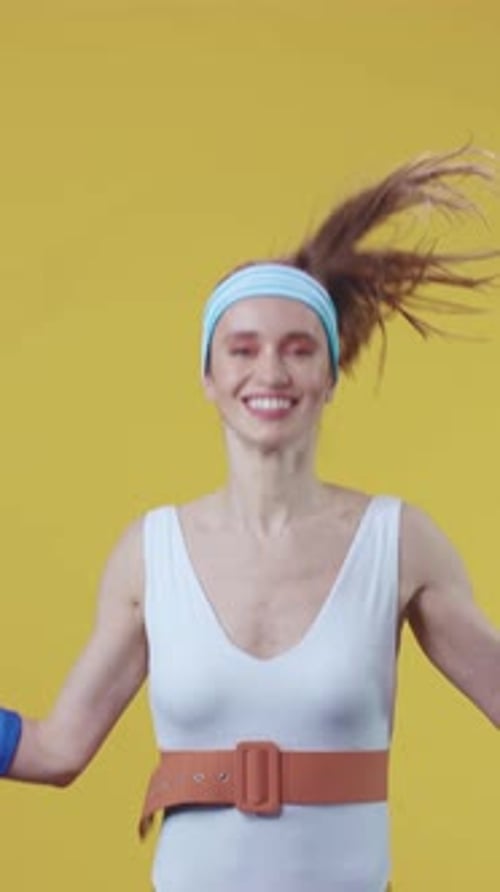 A Joyful and Energetic Fitness Enthusiast Wearing Bright and Colorful Workout Attire