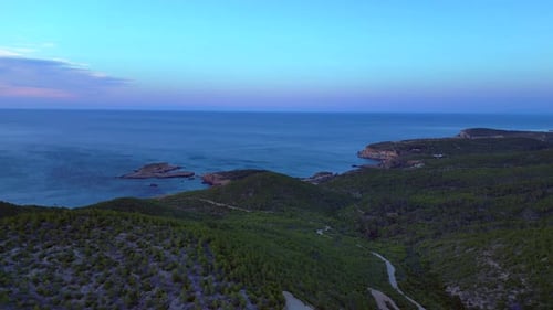 Ibiza coastline with green hills, Bays and sea. Spectacular aerial view flight drone