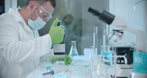 Scientist uses Pipette in Research Laboratory