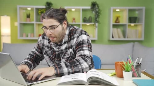 Stressed Student Studying at Desk