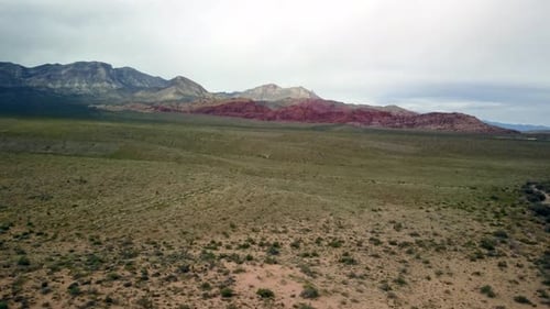 Aerial push in to the red rocks at Red Rock Canyon in Nevada