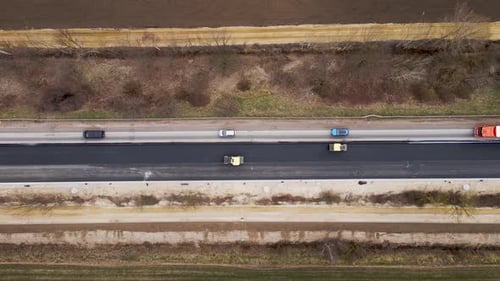 Rollers Level and Compact Asphalt Construction of New Road Road Surface Repair Aerial View