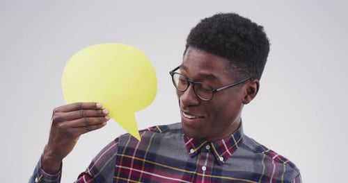 Young Man Holding Up a Speech Bubble