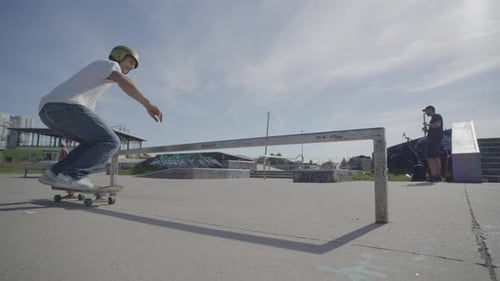 Skateboarding slow motion rail trick to 360 out