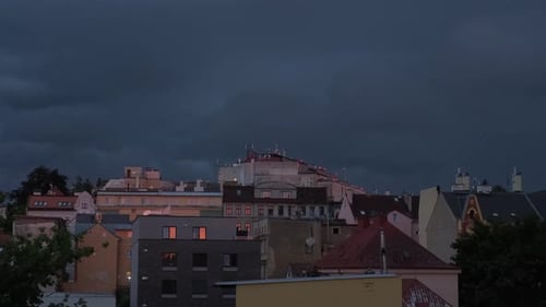 Dark Blue Clouds Over the Evening City The Beginning of a Storm Lightning in the Sky Timelapse