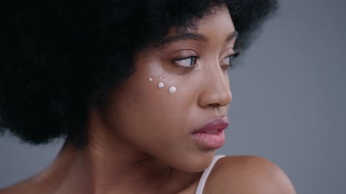 Woman with Moisturizer Posing in a Beauty Shot