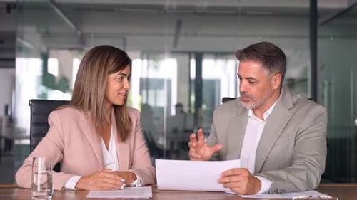 Attorney Showing Document to Client Providing Legal Consultancy Services