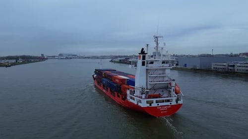 Containership Cargo Vessel On Waterways Near Dordrecht, South Holland Netherlands. Aerial Shot