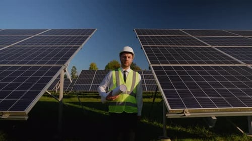 Engineer Inspects Solar Panels After Installation