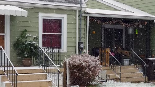Woden House in the snowy forest . POV shot of houses with snow fall in the morning time.