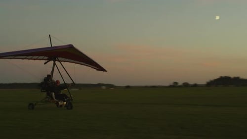 Motorized Hang Glider Taxiing at Golden Sunset