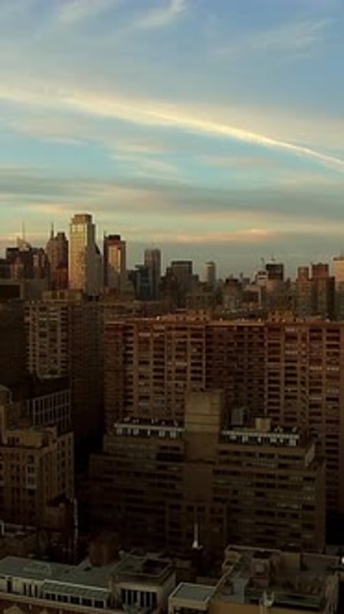 City Buildings Under Colorful Sunrise Sky