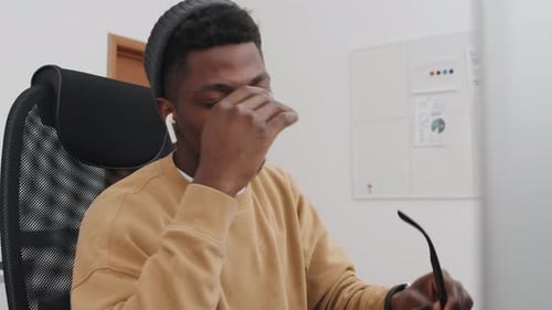 Young Man Taking Small Break At Work