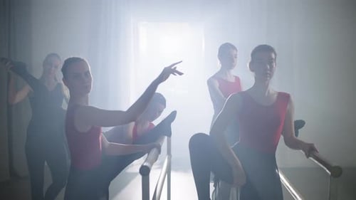 Elegant Ballet Dancers Practicing at the Barre