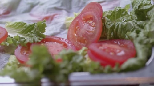 Close up shot of the greens and tomatoes