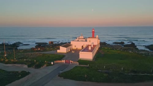 Amazing Evening Coastal Lighthouse Aerial View Pink Sky Over Beautiful Ocean