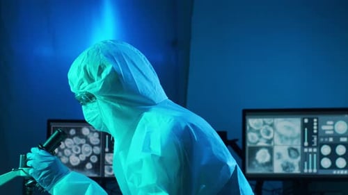 Scientist Using Microscope in a Modern Lab