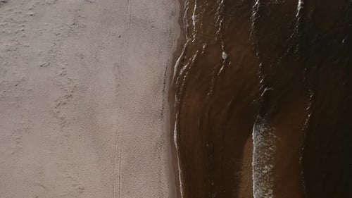 Drone Aerial View of Waves Sea Ocean Coast Beach and Dunes Dark Calm Sea Waves Nature Landscape