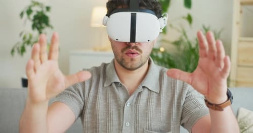 Man Wearing VR Headset at Home