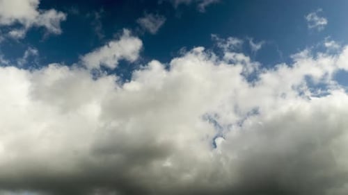 Timelapse of white and grey clouds with blue sky above Melbourne