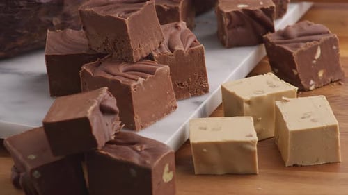 Various Flavors of Fudge on Cutting Board Background