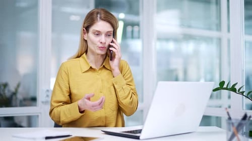 Woman on Phone in Modern Office Setting