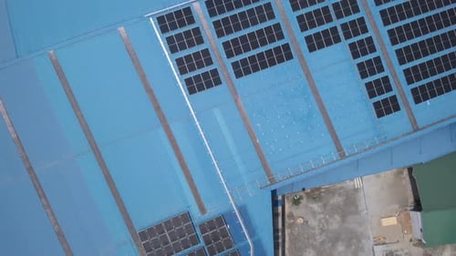 Aerial view of solar cell panels installed on roof of the factory. Go green save the planet