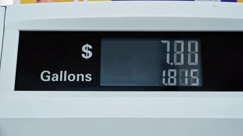 Gas Station Pump Display Showing Fuel Price and Gallons During Car Refueling Process