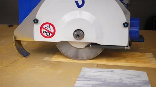 Industrial Saw Cuts Through Wood Material