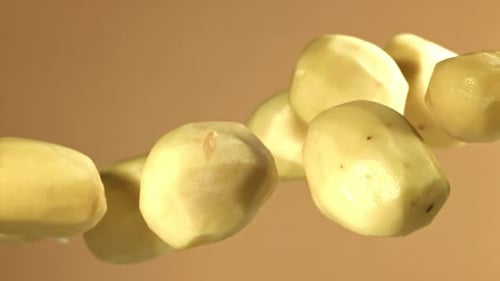 Peeled Potatoes Fly Up and Fall Down Filmed on a Highspeed Camera at 1000 Fps