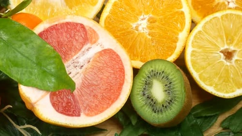 Fresh Citrus Fruits on a Wooden Board