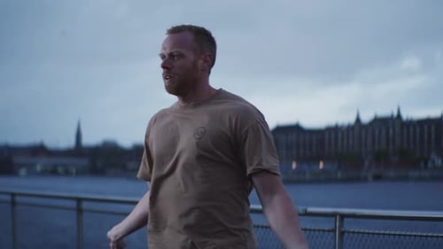 Man Skipping Rope in City Setting