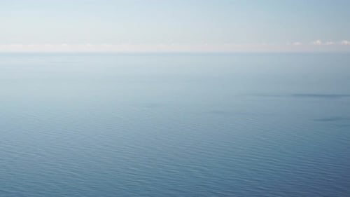 Aerial Panoramic View of Beautiful Sunset Above Sea Beautiful Seascape Sun Glare Small Waves on the